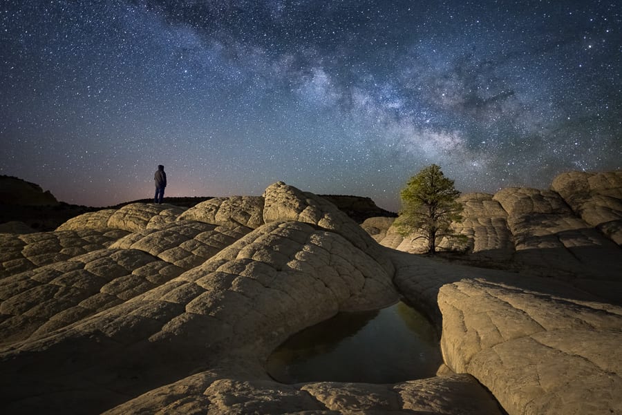 March Madness Here's another shot of some March Milky Way during an overnight client outing to White Pocket. It was well below freezing so we were glad the wind wasn't blowing like it was the evening before. Since the foreground puddle was frozen solid, I didn't think we would get any kind of reflections. However, once I got the image on the computer, I realized it would have been much better with the full tree reflecting on the ice. Oh well...