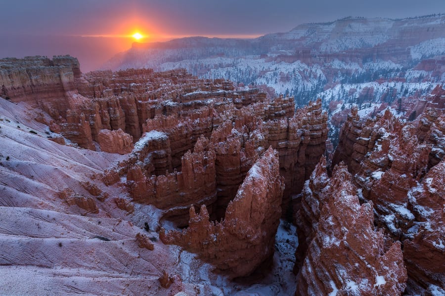 Here's a good image for the first day of December. I stopped by Bryce Canyon on Thanksgiving morning hoping to catch a nice break in the storm that was moving through the area. About 10 mins before sunrise, it started snowing again and you couldn't see anything. I was pretty sure I wasn't going to get any good shots that morning.  All of the sudden, the snow stopped and a small slit formed in the clouds to the east. It only lasted a couple minutes and produced such a beautiful glow in the snowy air. Definitely something to be thankful for!  I offer private photo tours of the Bryce, Zion, and Vermillion Cliffs areas.  Visit my website to learn more!
https://actionphototours.com
