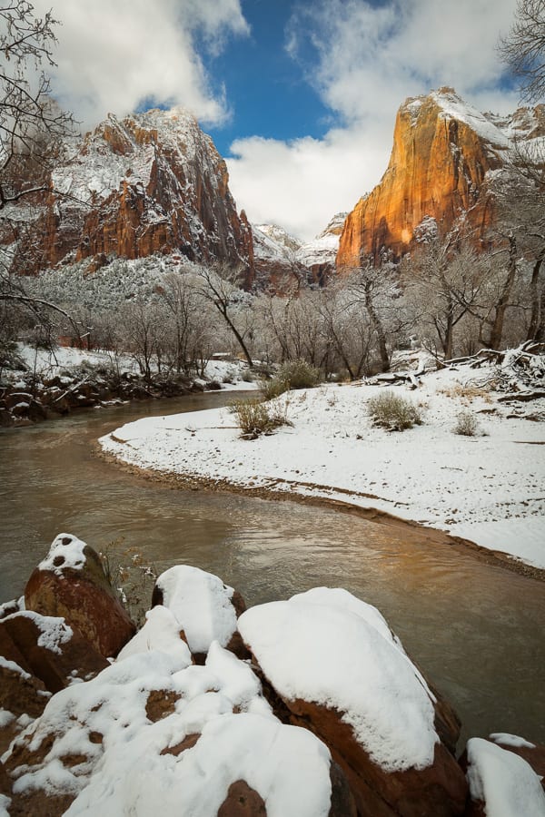 Zion National Park is a magical place when it snows. On this particular day, the skies started clearing just for a bit and the sun tried to pop out a few times, but it wasn't long before the clouds regained the upper hand. I stopped at the Court of the Patriarchs just in time to catch some dappled sunlight on the peak.