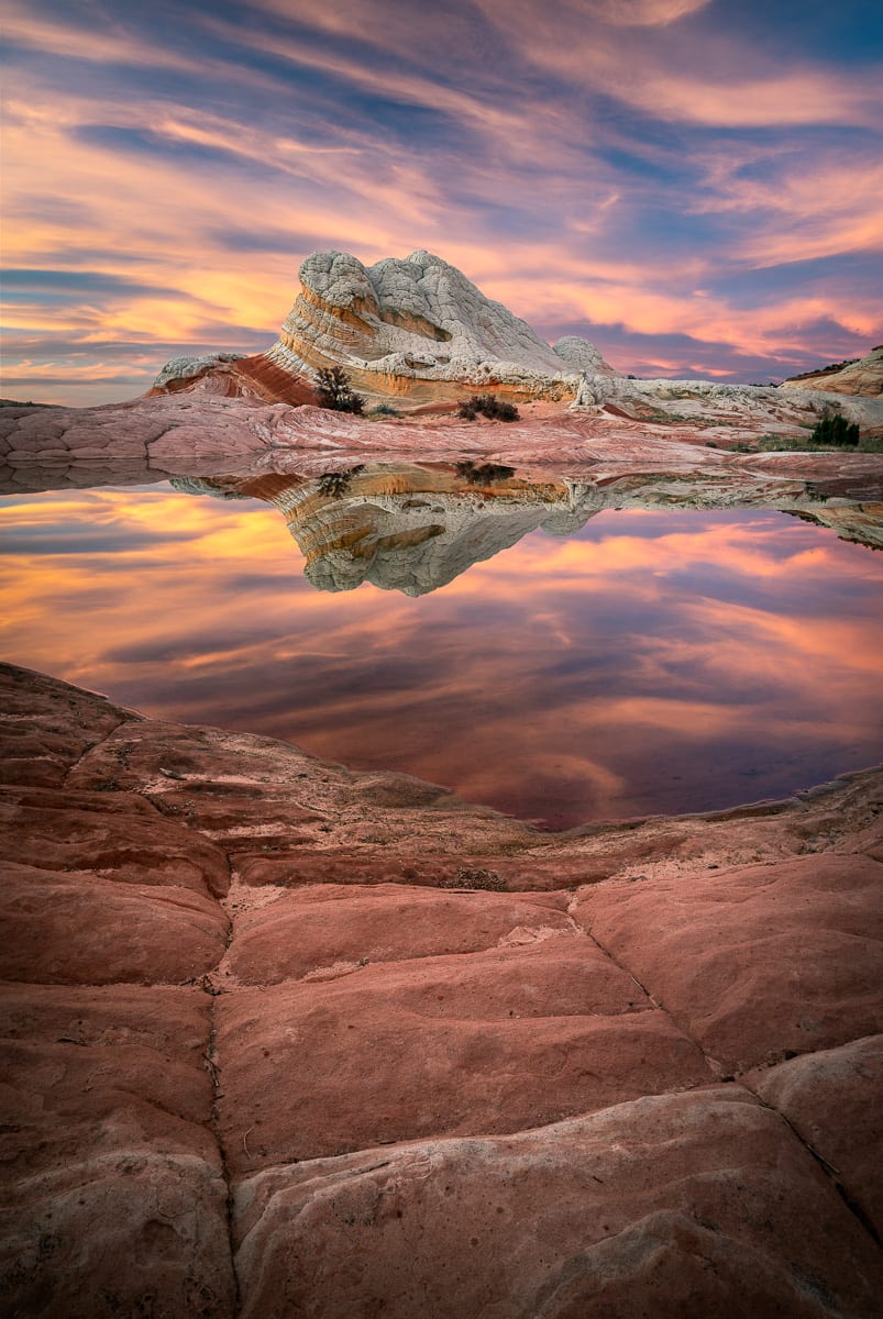 These are some of the best conditions I've ever seen out at White Pocket. Absolutely no wind, full water pockets, and beautiful clouds.  I actually had to remove some of the color to make it look natural. Our clients were stoked and came away with some incredible images.  Come explore the Southwest with us!  All tours include professional photography instruction and we'll get you out to the best locations.  https://actionphototours.com/utah-photo-tours/