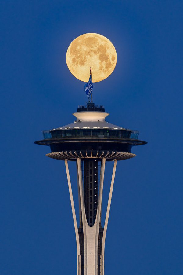 Supermoon and Space Needle Seattle. Shooting with a long lens on a tripod.